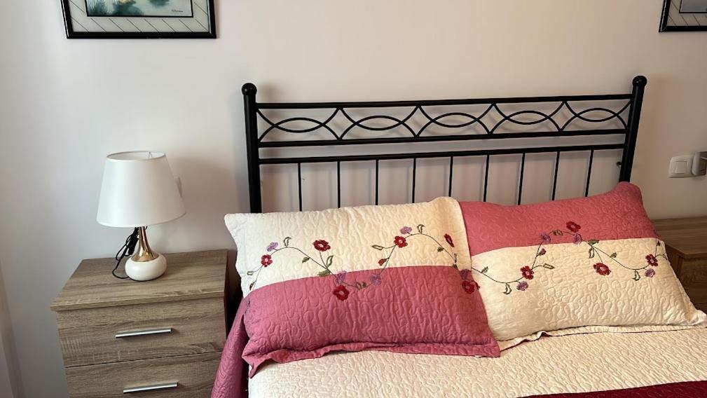 Posteľ alebo postele v izbe v ubytovaní APARTAMENTO A PIE DE PLAYA