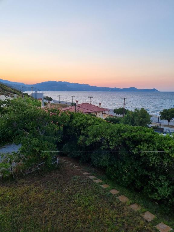 a view of the ocean from the balcony of a house at Aegean Villa in Mourteri