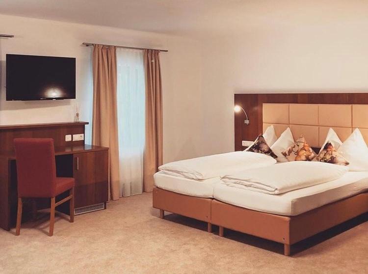Postel nebo postele na pokoji v ubytování Hotel Restaurant Häupl