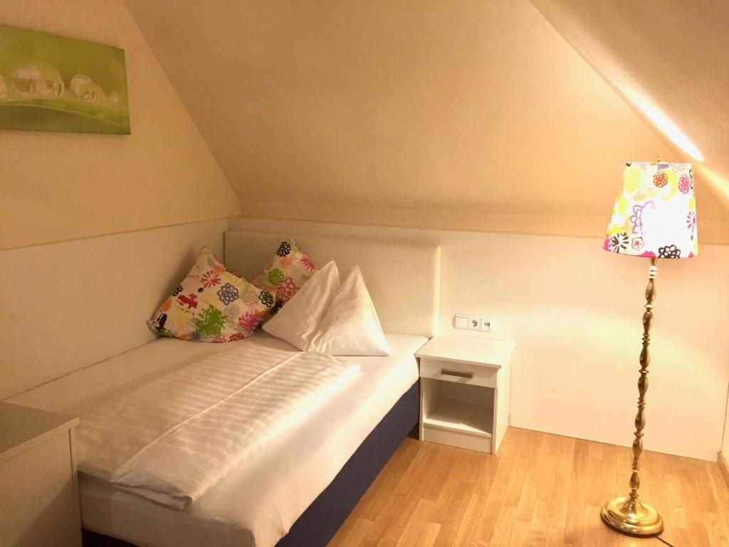 Postel nebo postele na pokoji v ubytování Hotel Restaurant Häupl