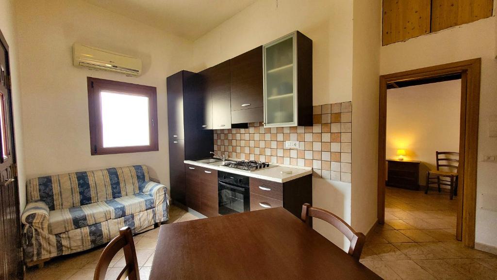 Kuchyň nebo kuchyňský kout v ubytování Residenza Le Orchidee