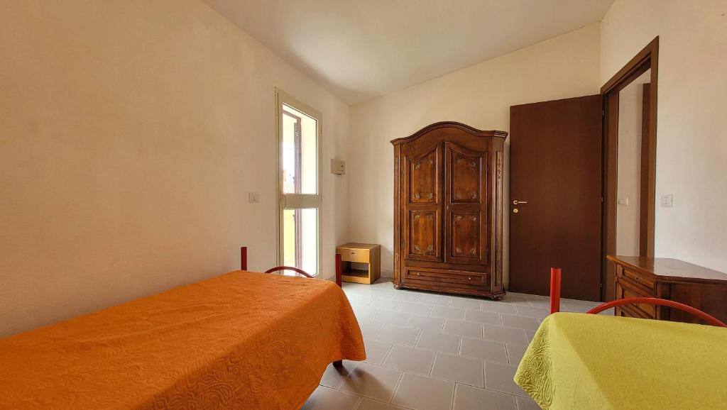 Postel nebo postele na pokoji v ubytování Residenza Le Orchidee
