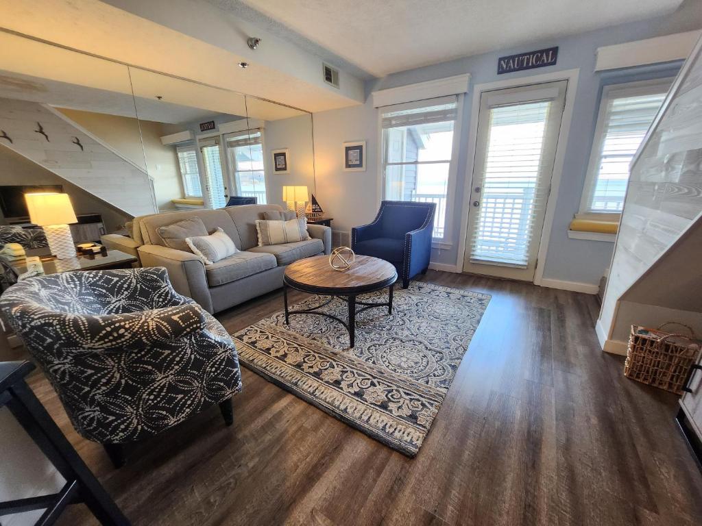 a living room with a couch and a table at North Shore Inn TC 307 in Traverse City