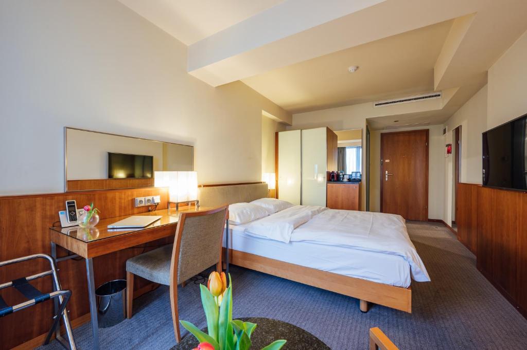 Postel nebo postele na pokoji v ubytování Peakture Hotel