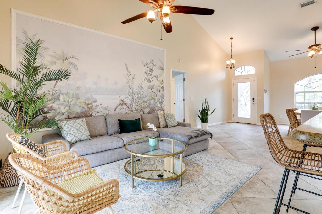 a living room with a couch and a table at Pet-Friendly Valrico Vacation Home with Lanai! in Valrico