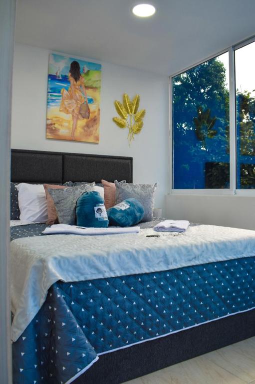 Postel nebo postele na pokoji v ubytování Ayenda Ceiba Rooms