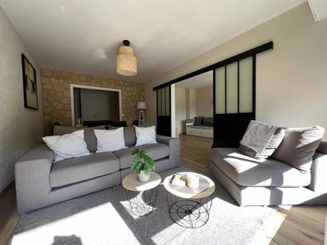 a living room with a couch and a table at Appartement CLUSES CENTRE in Cluses