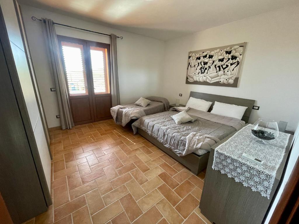 Postel nebo postele na pokoji v ubytování I Puntoni Agriturismo