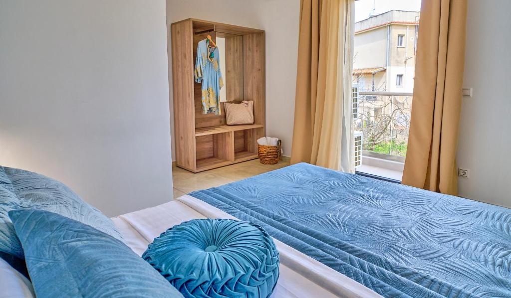 Postel nebo postele na pokoji v ubytování Sunflower Suites Gouvia Corfu