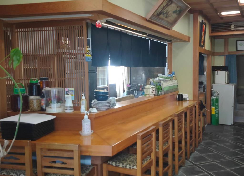a kitchen with a wooden counter with a window at Hidaka-gun - House - Vacation STAY 99266v in Haneda