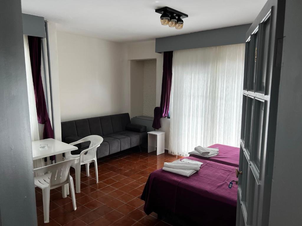 Postel nebo postele na pokoji v ubytování Andy's Apart Hotel
