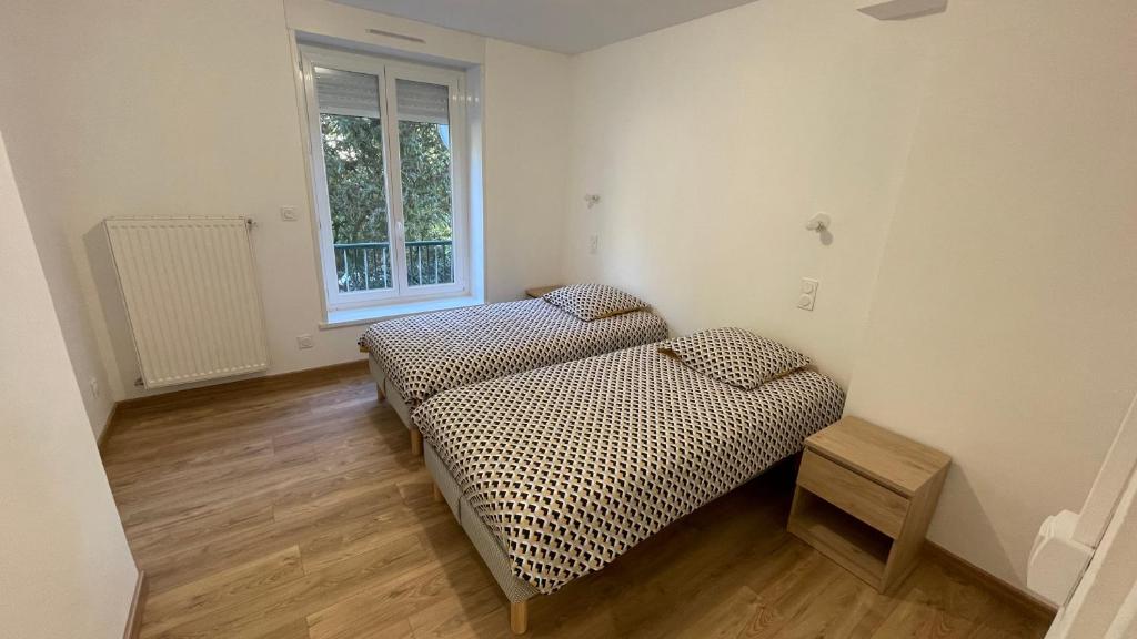 Posteľ alebo postele v izbe v ubytovaní Au Beau Duplex de la Basilique