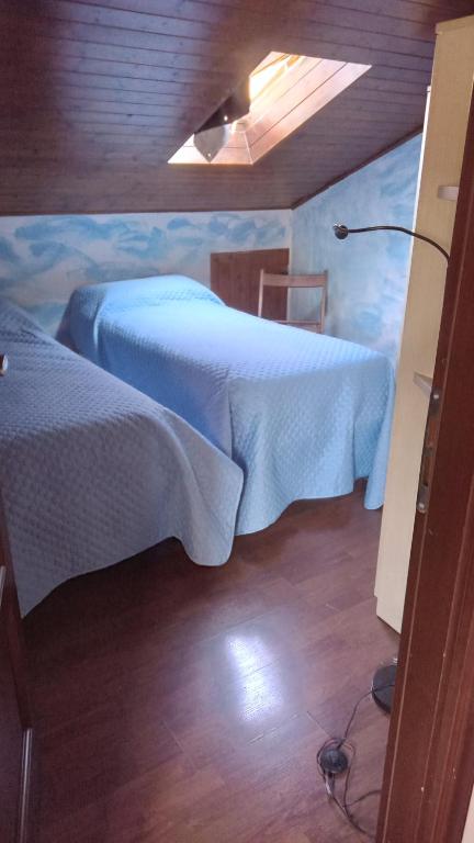 Tempat tidur dalam kamar di Centro Spotorno-Melting Pot