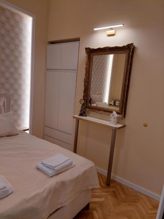 Postel nebo postele na pokoji v ubytování Zati Suite