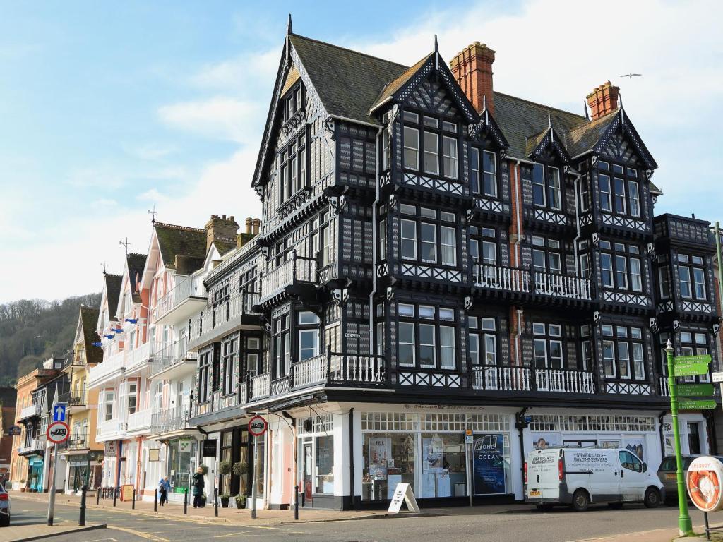 a large black and white building on a street at 2 York House in Dartmouth