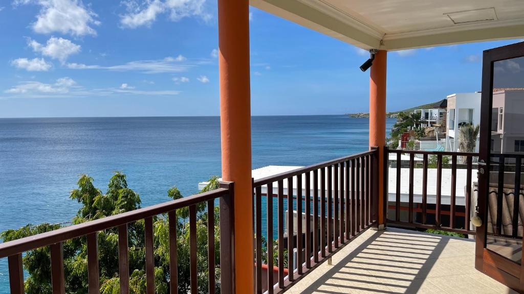 a balcony with a view of the ocean at Vacation house at Playa Lagun Private Beach in Lagun