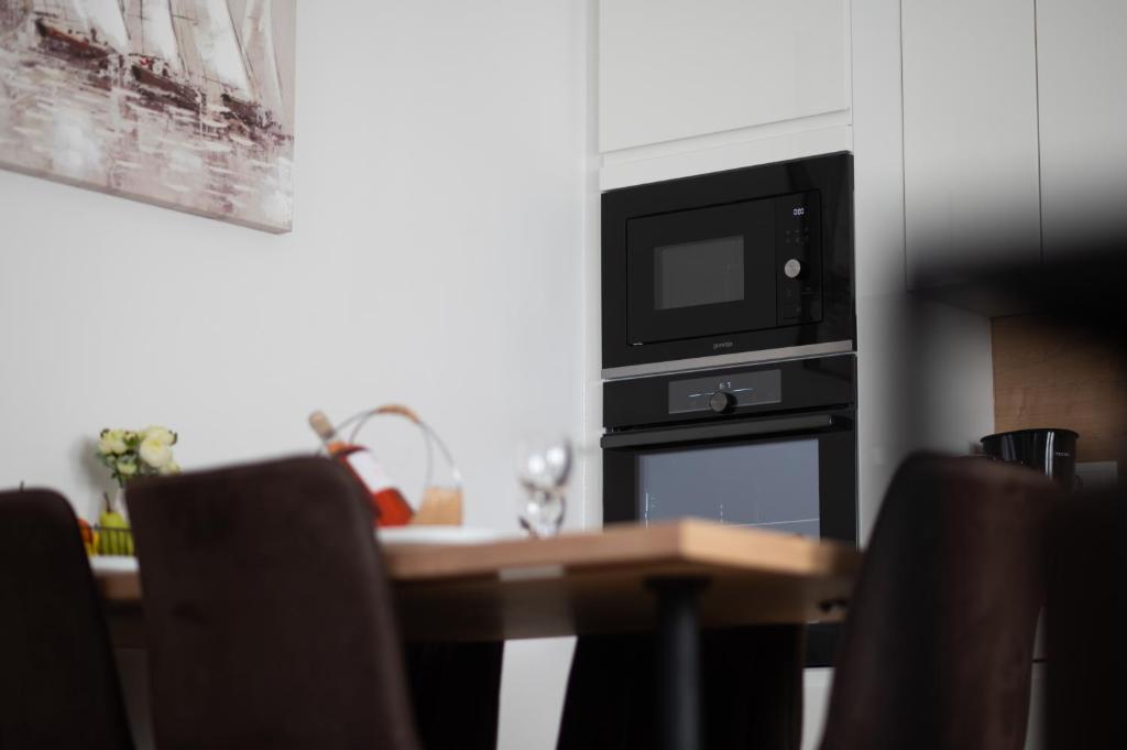 Kuchyň nebo kuchyňský kout v ubytování Apartments Batur