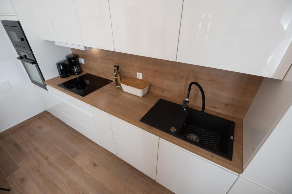 Kuchyň nebo kuchyňský kout v ubytování Apartments Batur