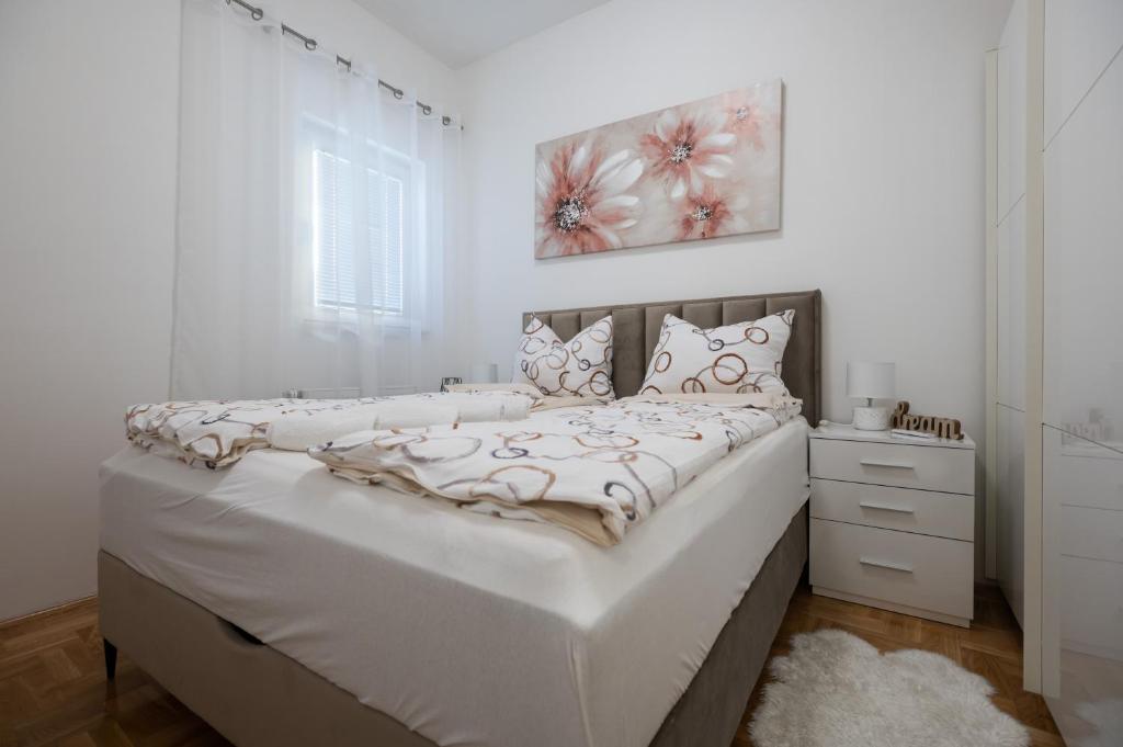 Postel nebo postele na pokoji v ubytování Apartments Batur
