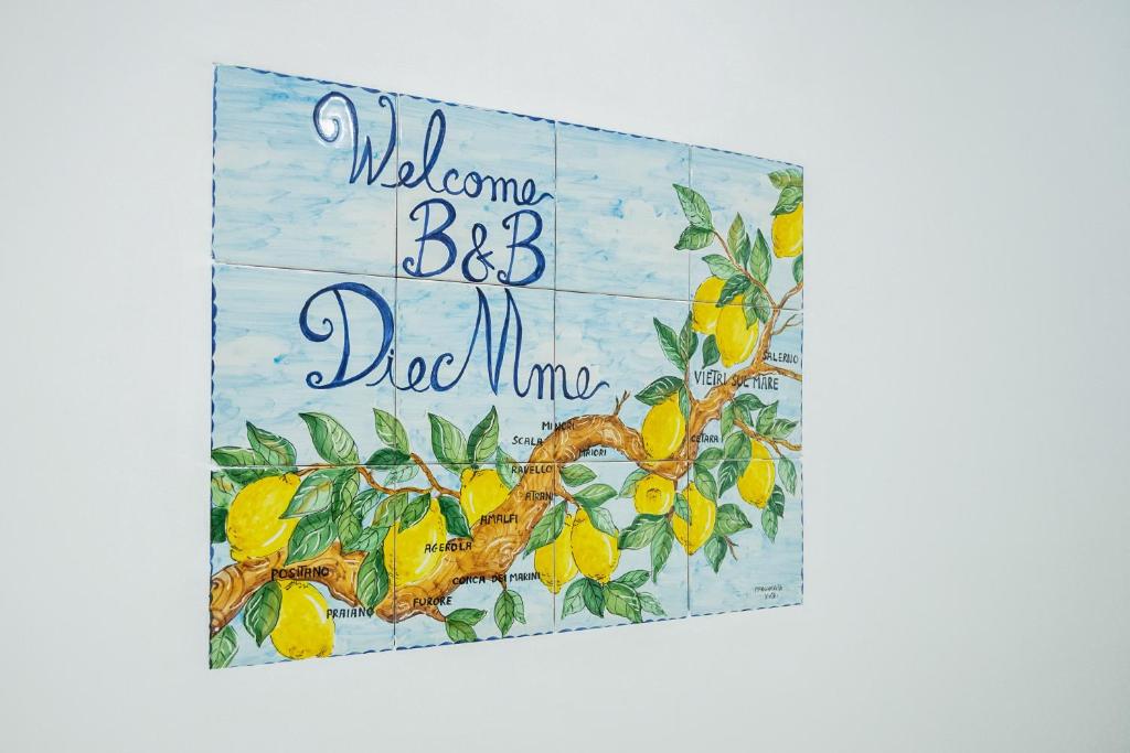 un signe avec un citronnier avec les mots « Bienvenue papa maman » dans l'établissement B&B DieMme Amalfi Coast, à Vietri