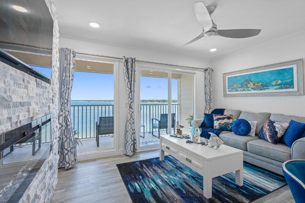 a living room with a couch and a fireplace at Sunset Paradise - Find yourself in Tampa in Tampa
