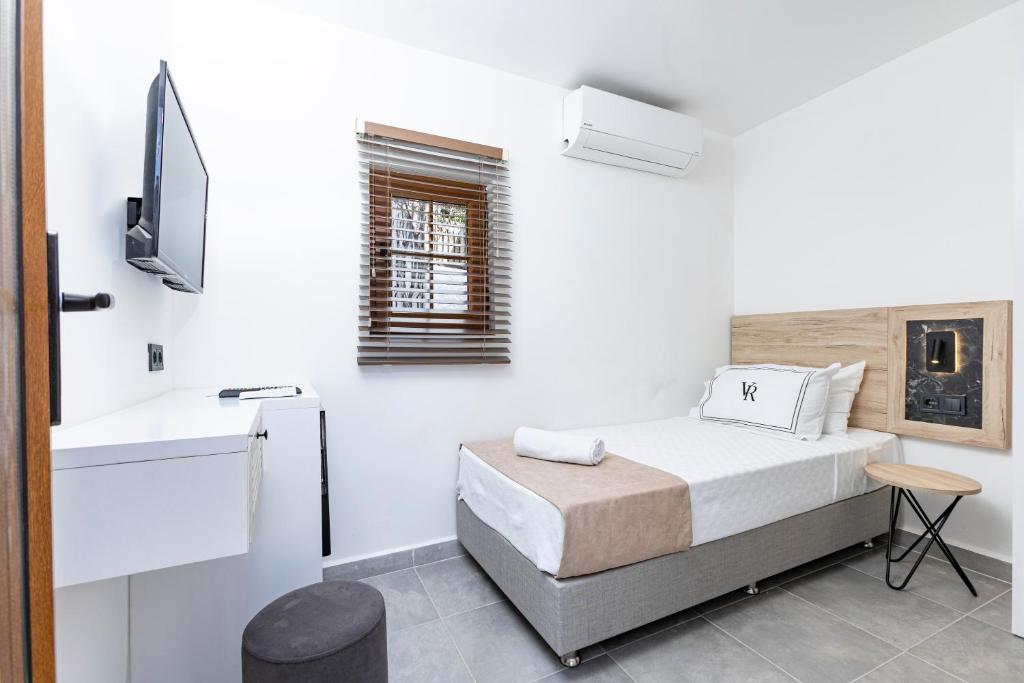 Postel nebo postele na pokoji v ubytování Bodrum Vera Hotel
