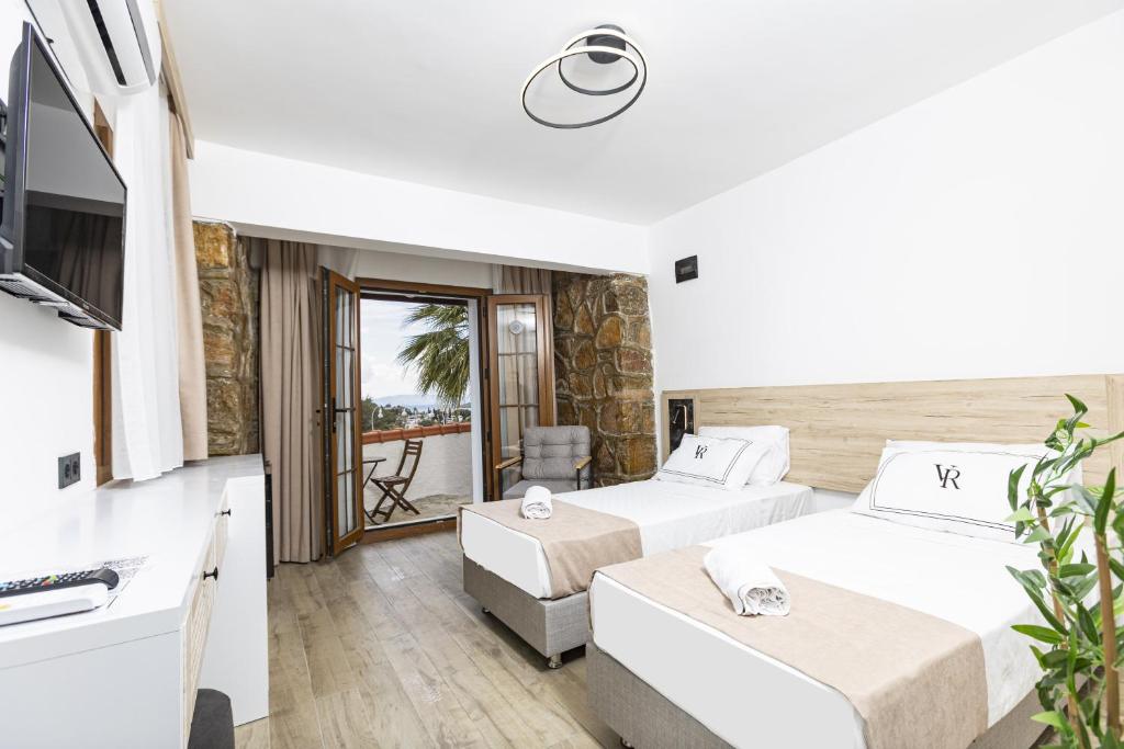 Postel nebo postele na pokoji v ubytování Bodrum Vera Hotel