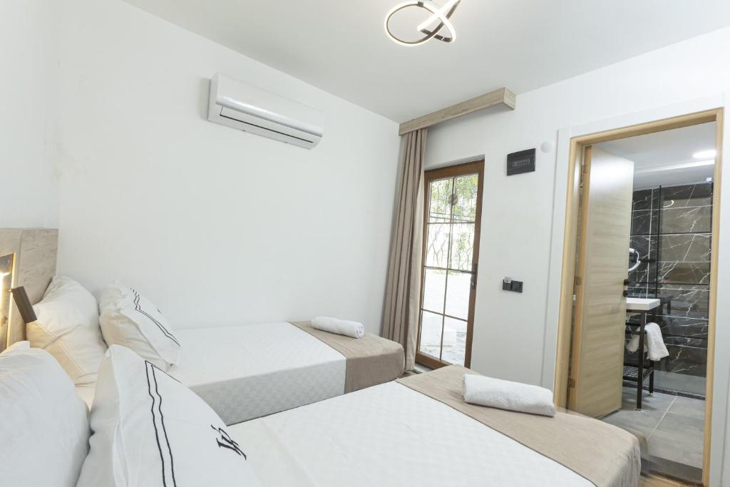 Postel nebo postele na pokoji v ubytování Bodrum Vera Hotel