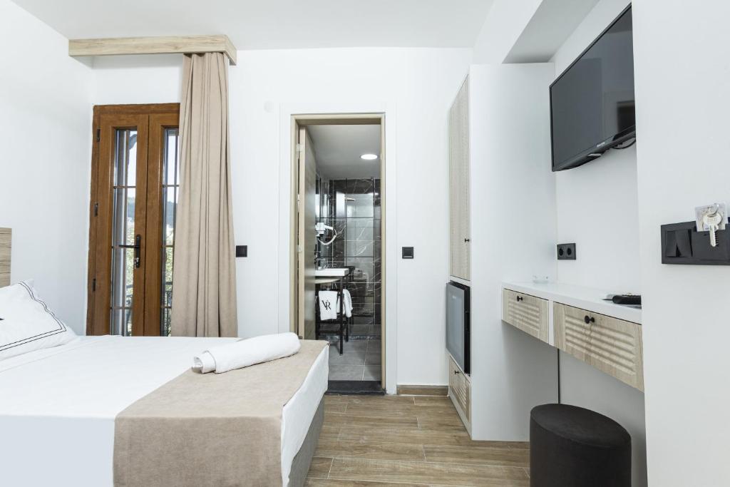 Postel nebo postele na pokoji v ubytování Bodrum Vera Hotel