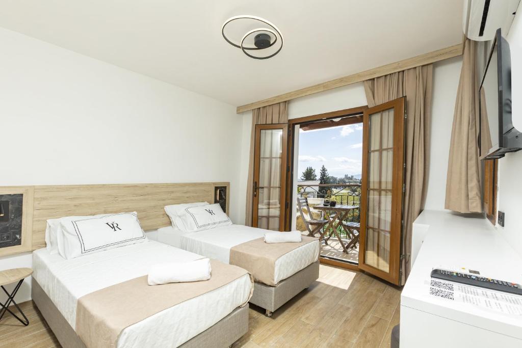 Postel nebo postele na pokoji v ubytování Bodrum Vera Hotel