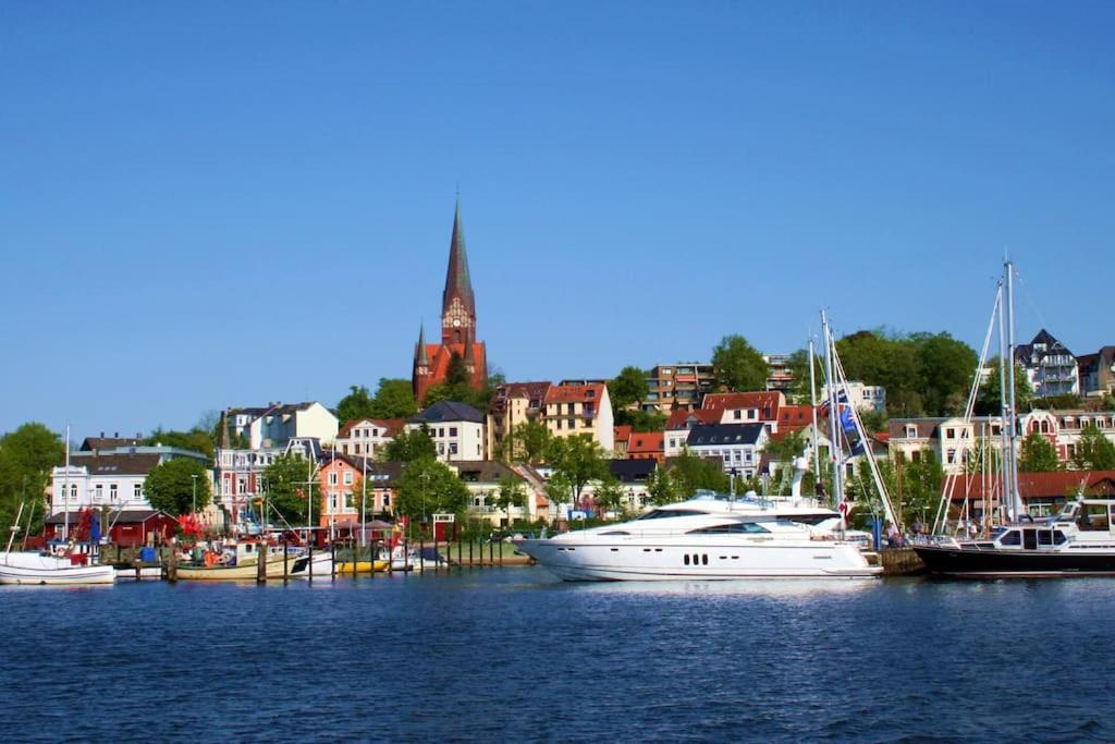 a group of boats are docked in a harbor at Gemütliche 2-Zi-Whg, Strandnähe, kostenloser Parkplatz, Schlüsselbox, 24/7 Selfcheckin in Flensburg