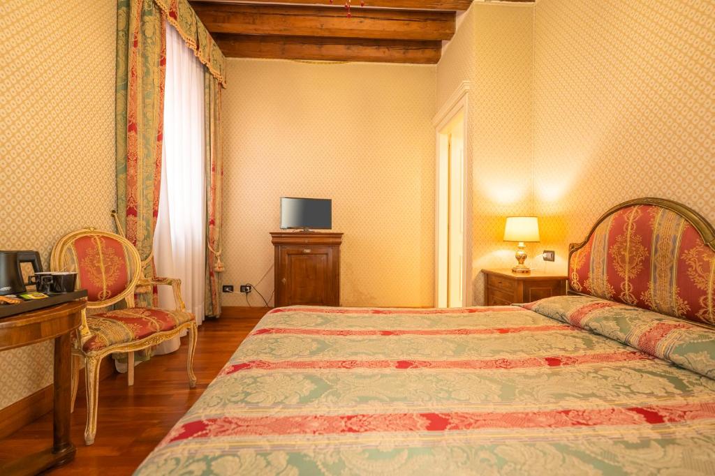 Postel nebo postele na pokoji v ubytování Cà Valeri