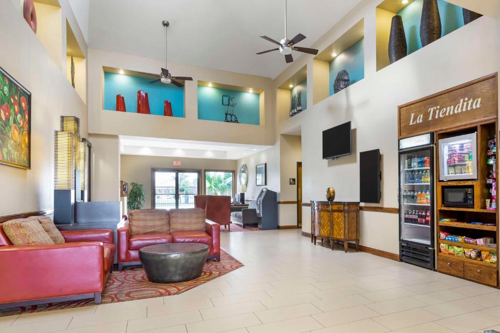 a lobby of a hospital with couches and chairs at Best Western Mcallen Medical Center in McAllen