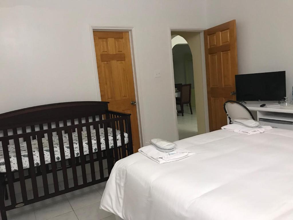 Postel nebo postele na pokoji v ubytování Compassionate Touch Spa & Accommodation