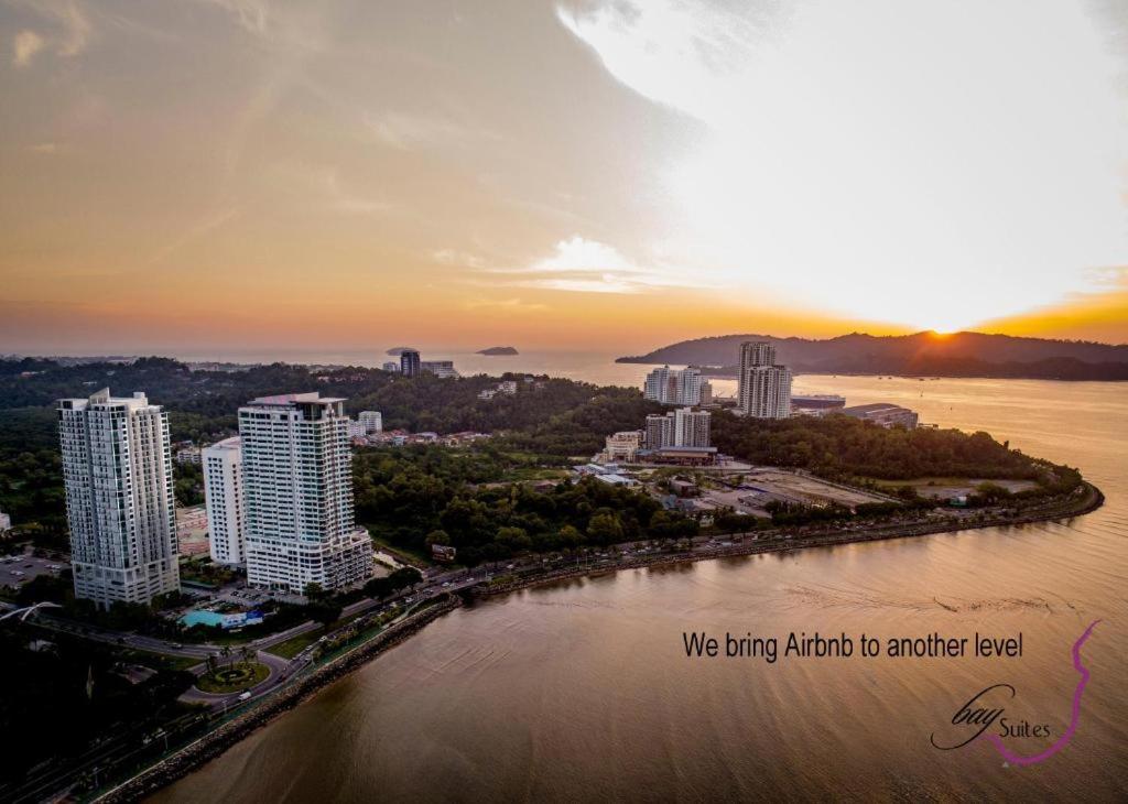 an aerial view of a city next to the water at b.suites 21 in Kota Kinabalu
