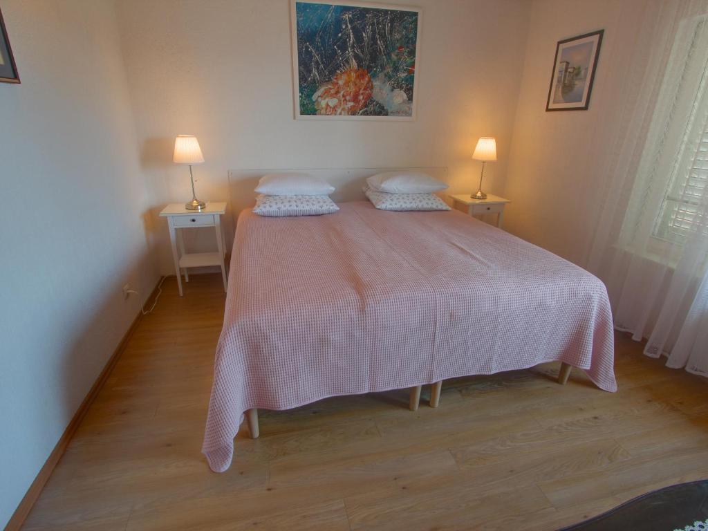 Łóżko lub łóżka w pokoju w obiekcie Premium Apartments Punta Kolova