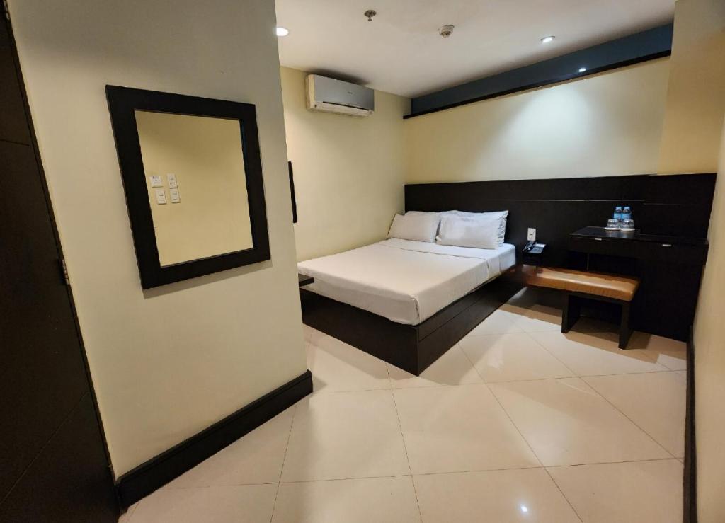 מיטה או מיטות בחדר ב-Green Glass Hotel