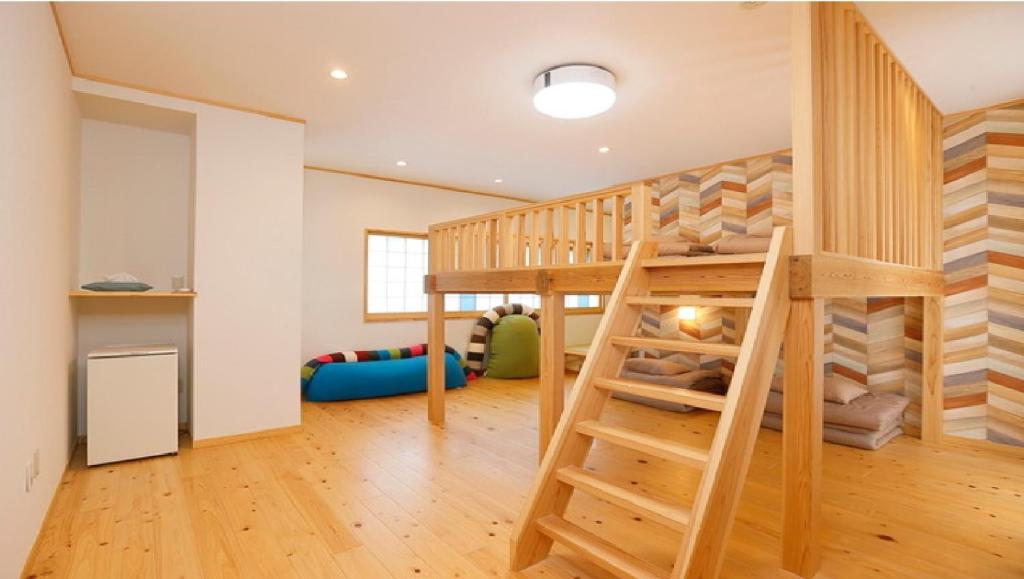 Postel nebo postele na pokoji v ubytování Onsen Petit Hotel Yukori Bandai Atami