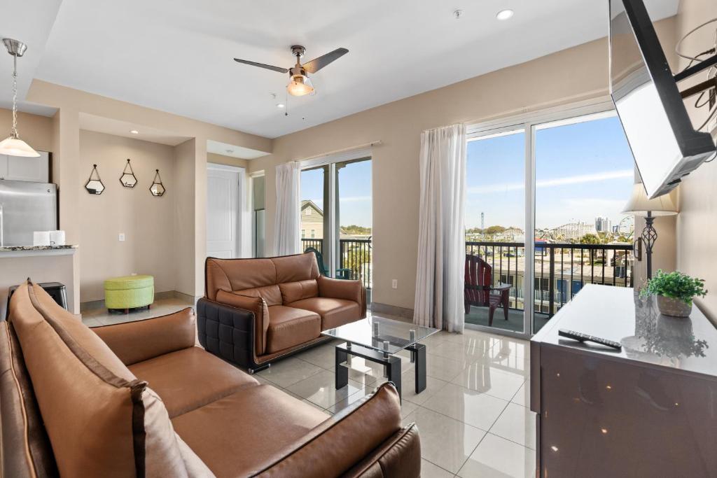 a living room with furniture and a balcony at Bali Bay 301 OV Myrtle Beach Hotel Room in Myrtle Beach