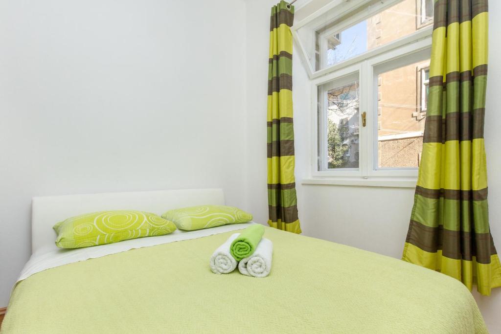 Postel nebo postele na pokoji v ubytování Central Jardin Guest House Split