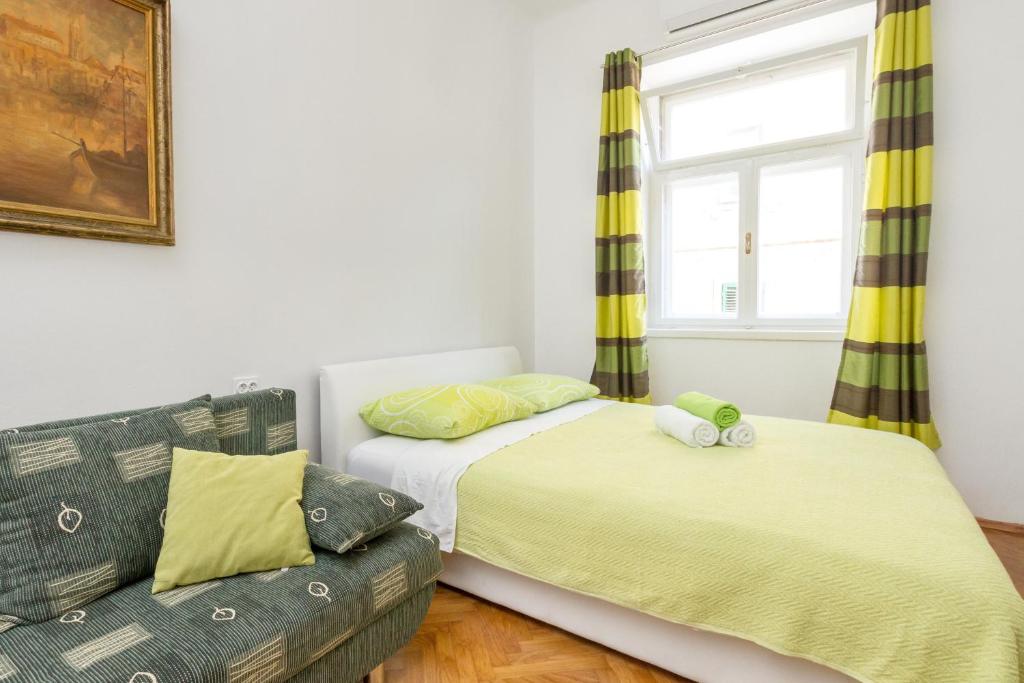 Postel nebo postele na pokoji v ubytování Central Jardin Guest House Split