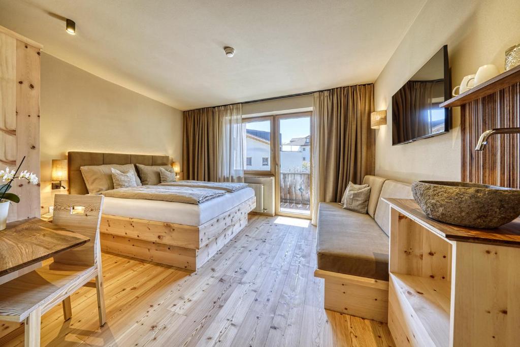 Postel nebo postele na pokoji v ubytování Eco Bnb & Apartments Bründlerhof