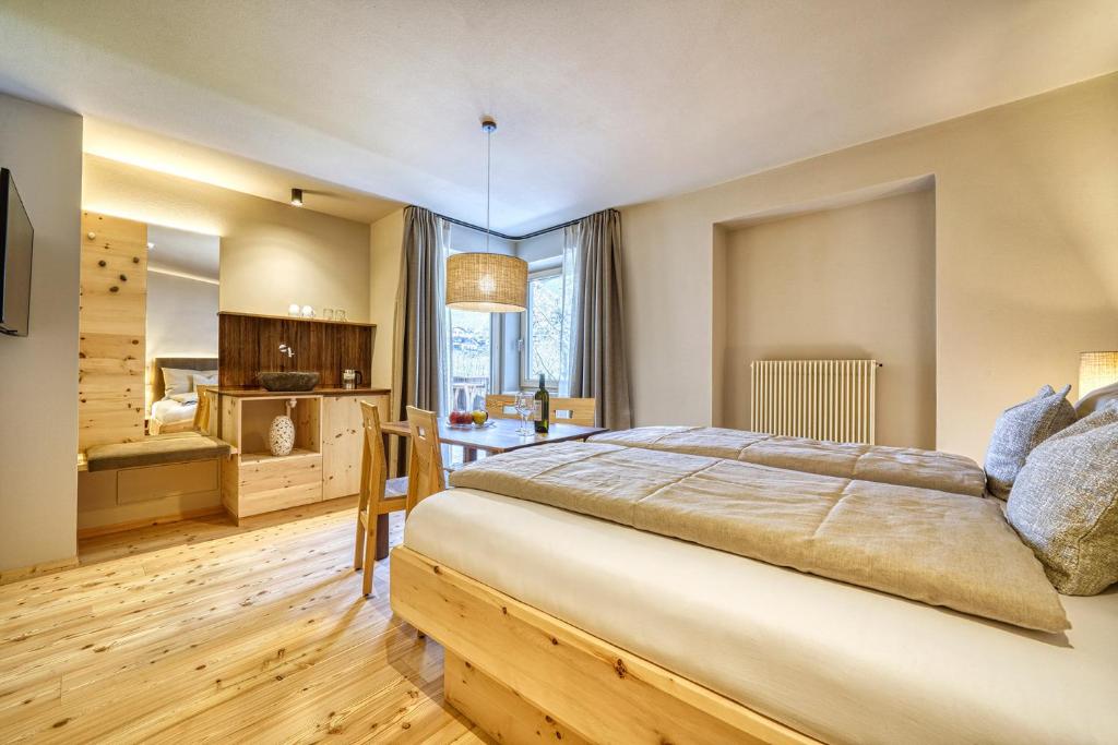 Postel nebo postele na pokoji v ubytování Eco Bnb & Apartments Bründlerhof