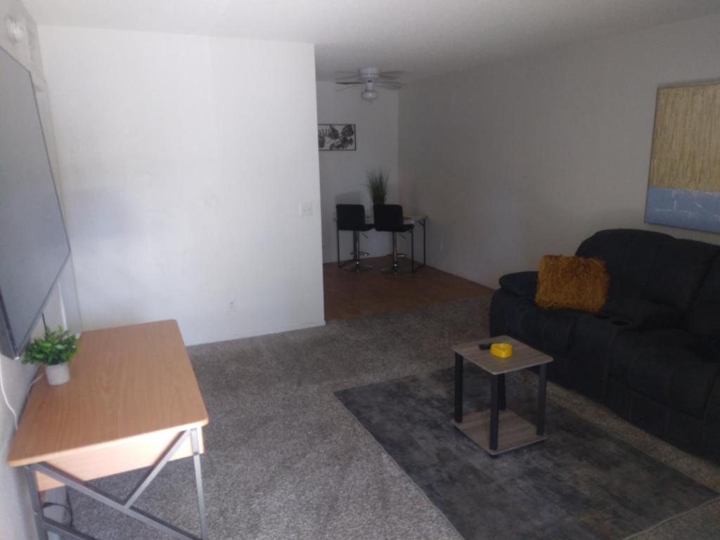 a living room with a couch and a table at Walking distance to casinos & dispensarys in Las Vegas
