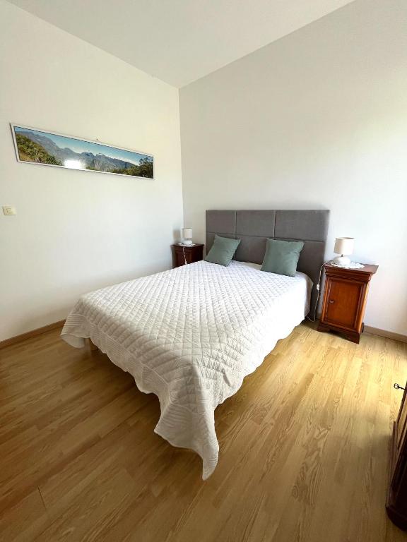 Postel nebo postele na pokoji v ubytování Le Quindio