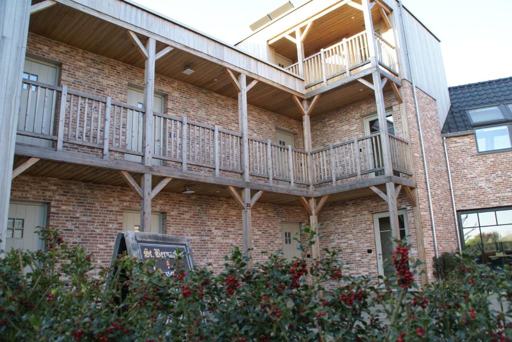 a brick building with balconies on the side of it at B&B Sasput in Hasselt