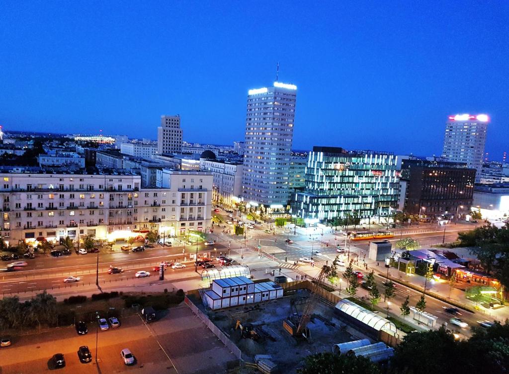 a view of a city at night with buildings at A.G-Apartamenty Warszawa Centrum in Warsaw