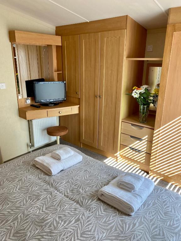 Letto o letti in una camera di Earls View Caravan