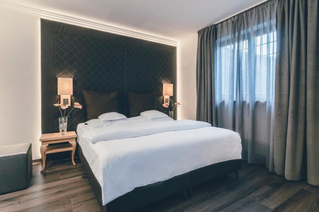 Postel nebo postele na pokoji v ubytování Golserhof