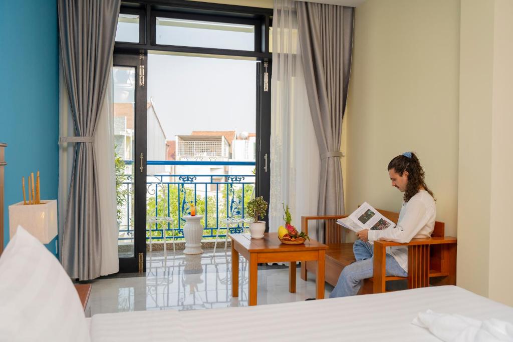 Postel nebo postele na pokoji v ubytování Hoi An Heart hostel Villa - Bespoke